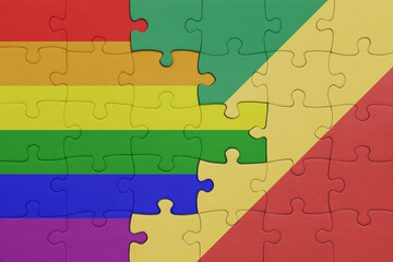 puzzle with the colourful national flag of republic of the congo and rainbow gay pride flag .