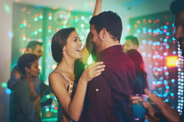 Couple, celebrate and dance in club at night on date with love in marriage or relationship. People,...