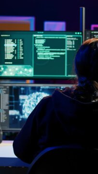 Vertical video Rogue computer scientist uses AI machine learning to develop zero day exploit undetectable by antivirus. Hacker uses artificial intelligence neural networks to build script tricking