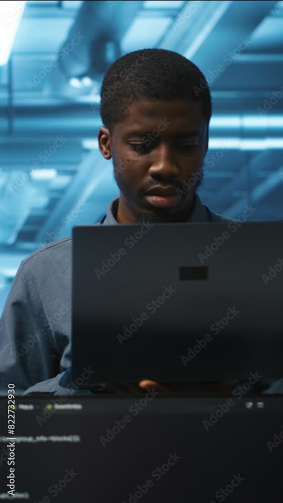 Poster vertical video portrait of happy manager supervising server rows in computer network security data c
