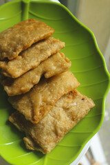 Deep fried tempeh or Tempe Mendoan is Indonesian traditional food made from tempeh covered in flour batter.