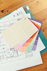 Color, swatch and planning home renovation with blueprint on table from above with interior design....