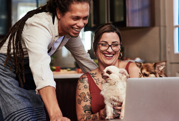 Happy, couple and laptop to relax with dogs at house in kitchen browsing internet for online...