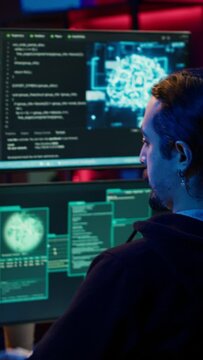 Vertical video Rogue computer scientist uses AI machine learning to develop zero day exploit undetectable by antivirus. Hacker uses artificial intelligence neural networks to build script tricking