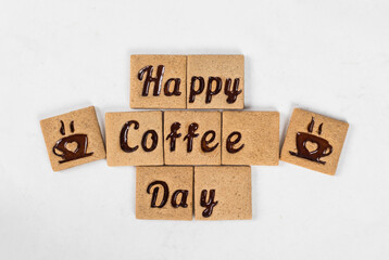 Coffee square cookies with coffee marmalade filling in the form of Happy Coffee Day words and a cup...