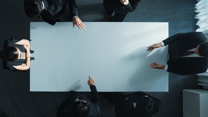 Top down aerial view of smart cooperate businessman discussing about marketing strategy. Diverse...