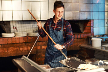 Baking, pizza and happy man in restaurant kitchen for fast food, delicious meal or hospitality...