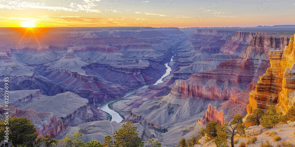 Wall mural breathtaking view of grand canyon with sunrise over horizons and majestic colorado river creating st