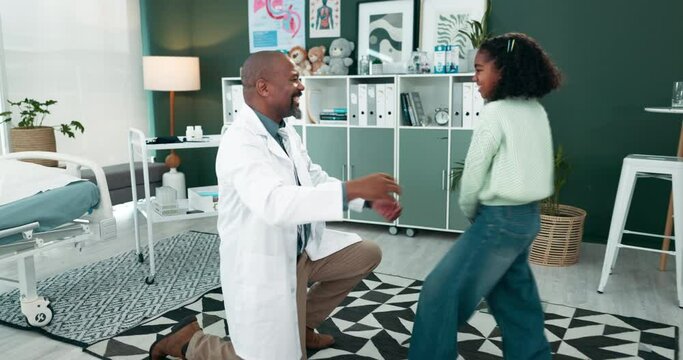 Happy doctor, fun handshake and little girl at clinic for healthcare, support or care at private practice. Medical employee with child, kid or fist bump with dab for career day at funny paediatrician