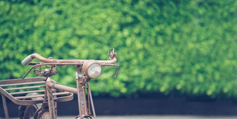 Vintage Bicycle on the wall decorate with bike cycle wheel in living room.Interior Design with people lifestyle hobby in a modern city. Bicycle with bulb lighting as background and loft decorate style