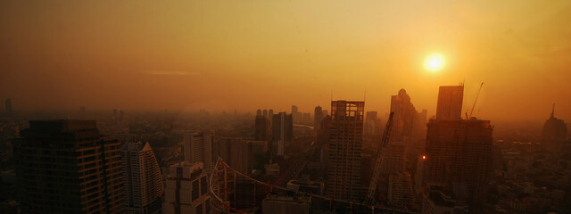 Sunset Amazing Bangkok city skyline with blue sky. Golden time Beautiful skyscraper bangkok midtown...