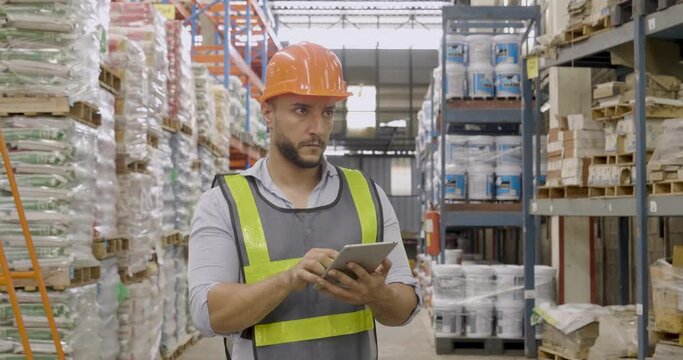 Hispanic men hands using typing laptop computer Warehouse management logistics counting checking products on inventory shelf. Engineer Man hands checklist stock control computer program in storage