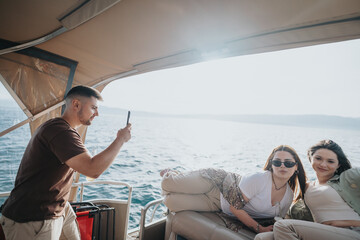 Carefree adults having fun and embracing relaxation on a holiday boat trip on the lake, feeling the...
