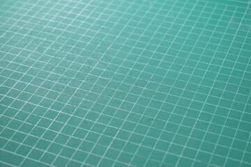 green cutting mat board background with line and scale measure guide pattern for object art design,...