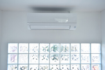 white air conditioner on wall, electricity object in home
