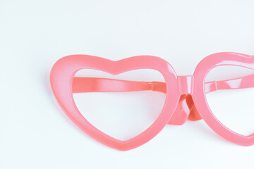 pink heart shape of glasses on white background