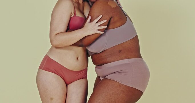 Body positivity, studio lingerie and women hug, care and support different shape, size or inclusivity. Closeup, friends and together with underwear or solidarity, equality and empowerment with pride.