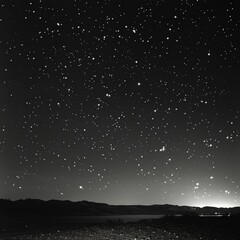 a black and white photo of a night sky with stars