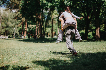 A cheerful man giving a joyful piggyback ride to a woman in a lush green park, showcasing a moment of carefree happiness and togetherness.