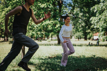 A lively scene in a sunlit park with two friends engaging in a playful chase, radiating joy and the...