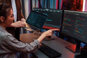 Serious of IT developers discussing intelligent website development coder system running data...