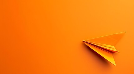 Orange colored paper plane is flying to the right on orange colored background