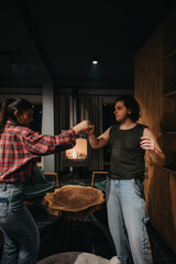 A joyful moment as friends raise a toast in a comfortable home atmosphere, exemplifying friendship and togetherness.