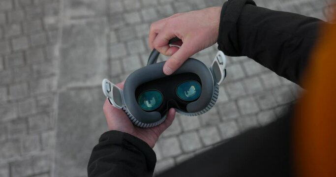 Attaching Seal Cushion To VR Headset Unit. Over Shoulder View 