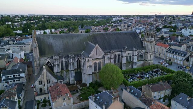 Cathedral of Saint Peter or Pierre at sunset in Poitiers city, France. Aerial drone sideways