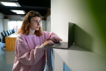 Businesswoman Using Computer in Modern Office. Stylish Beautiful Specialist. Happy Beautiful Worker. 