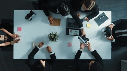 Top view of professional businessman give vr headset to diverse investors while young businesswoman looking at data analysis or marketing statistic on laptop and prepare for data sharing. Directorate.