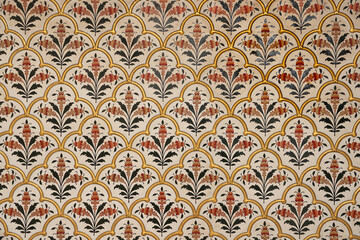 Seamless decorative pattern on the walls of historic Bikaner fort in Rajasthan, India.