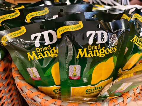 Lapu Lapu City, Cebu, Philippines - 7D packed dried mangoes for sale at a souvenir shop in an airport