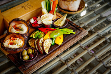 Mezze Plate. Whit Hummus, Olives, Crudites, Pita Bread, Baba Ghanoush. Various appetizing spanish mezze dishes.