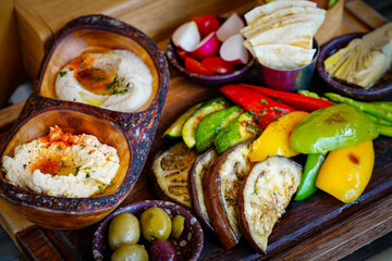 Mezze Plate. Whit Hummus, Olives, Crudites, Pita Bread, Baba Ghanoush. Various appetizing spanish mezze dishes.
