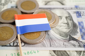 Netherlands flag on coin and banknote money, finance trading investment business currency concept.