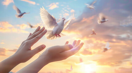 Hands open, releasing doves at sunset, symbolizing freedom and hope as the birds take flight into the sky. - Powered by Adobe