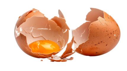 Cracked egg, eggshells with yolk isolated on a transparent background