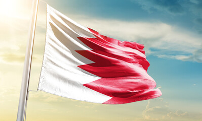 Bahrain national flag waving in beautiful sky.