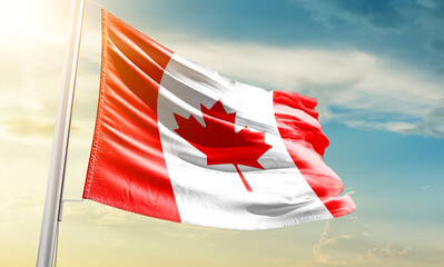 Canada national flag waving in beautiful sky.