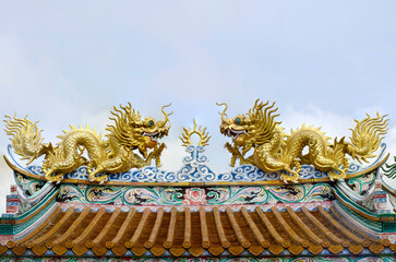 Chainese gold dragon on blue sky backgrounds