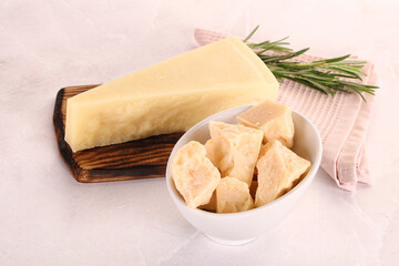 Chopped Italian hard parmesan cheese