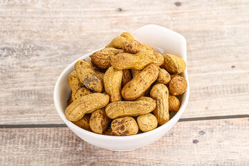 Raw ripe unpeeled peanut heap