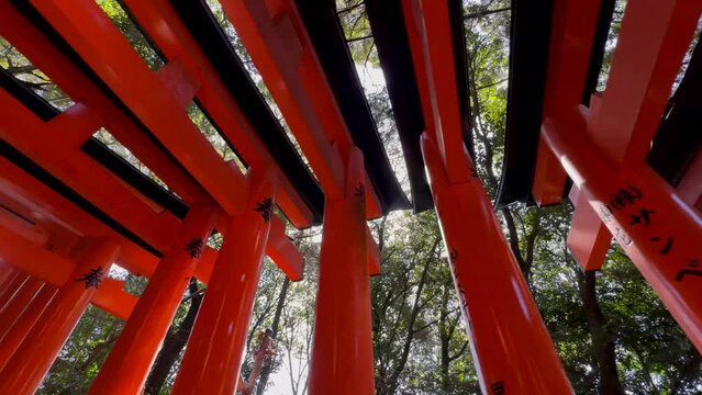 Bottom up view of the vermilion arches of Fushimi Inari Taisha in Kyoto Japan.