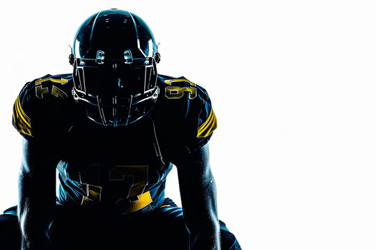 Silhouette of American football player kneeling on white background