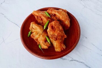 Tahu isi goreng is Indonesian fried tofu filled with vegetables and usually served with green chili