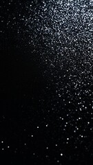 Obraz premium sparkling silver glitter against black background. concepts: aerosols, graphic element in web design or digital media, background for advertisements or product displays, designer backdrop.