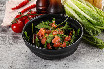 Salad with salmon and arugula