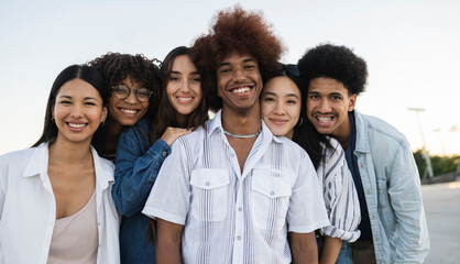 Diverse Group of Young Adults Smiling Together Outdoors