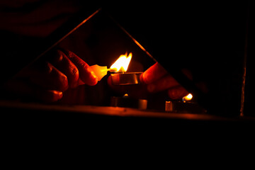 Women Lighting a candle in the night on the festive occasion. Closeup. Festive of Lights special. Diwali